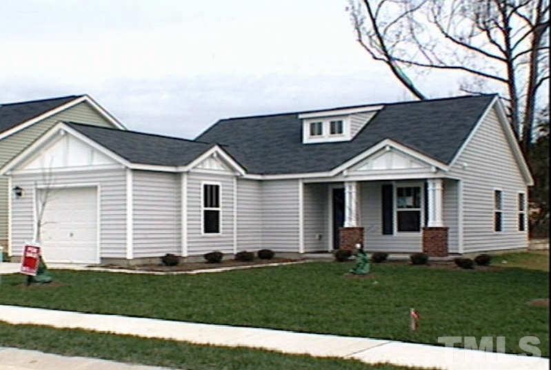 3819 Hopper Street Raleigh, NC 27616 - Photo 1 of 3 a front view of a house with a yard and garage