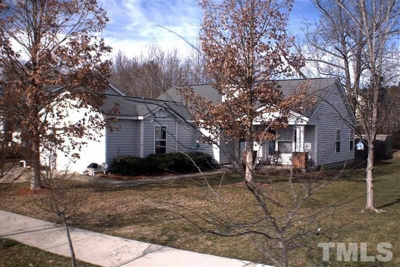 3819 Hopper Street Raleigh, NC 27616 - Photo 2 of 3 a backyard of a house with large trees
