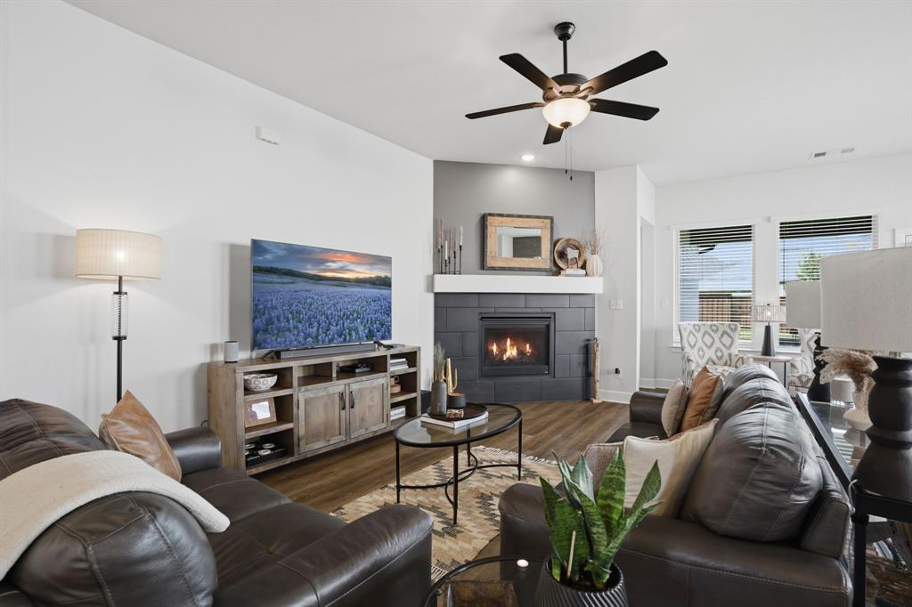 1632 Cotton Road Van Alstyne, TX 75495 - Photo 4 of 40 a living room with furniture and a fireplace