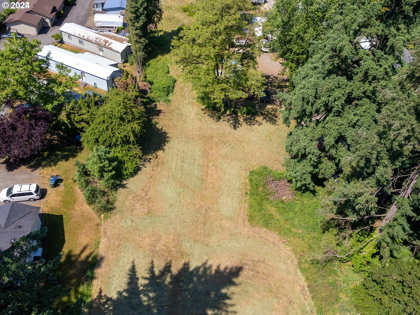 766 K Street Washougal, WA 98671 - Photo 4 of 11 a view of a lake in a forest