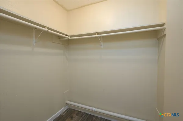 a view of a room with shelf on the wall