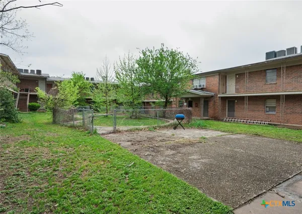 a front view of a house with a yard and a garage