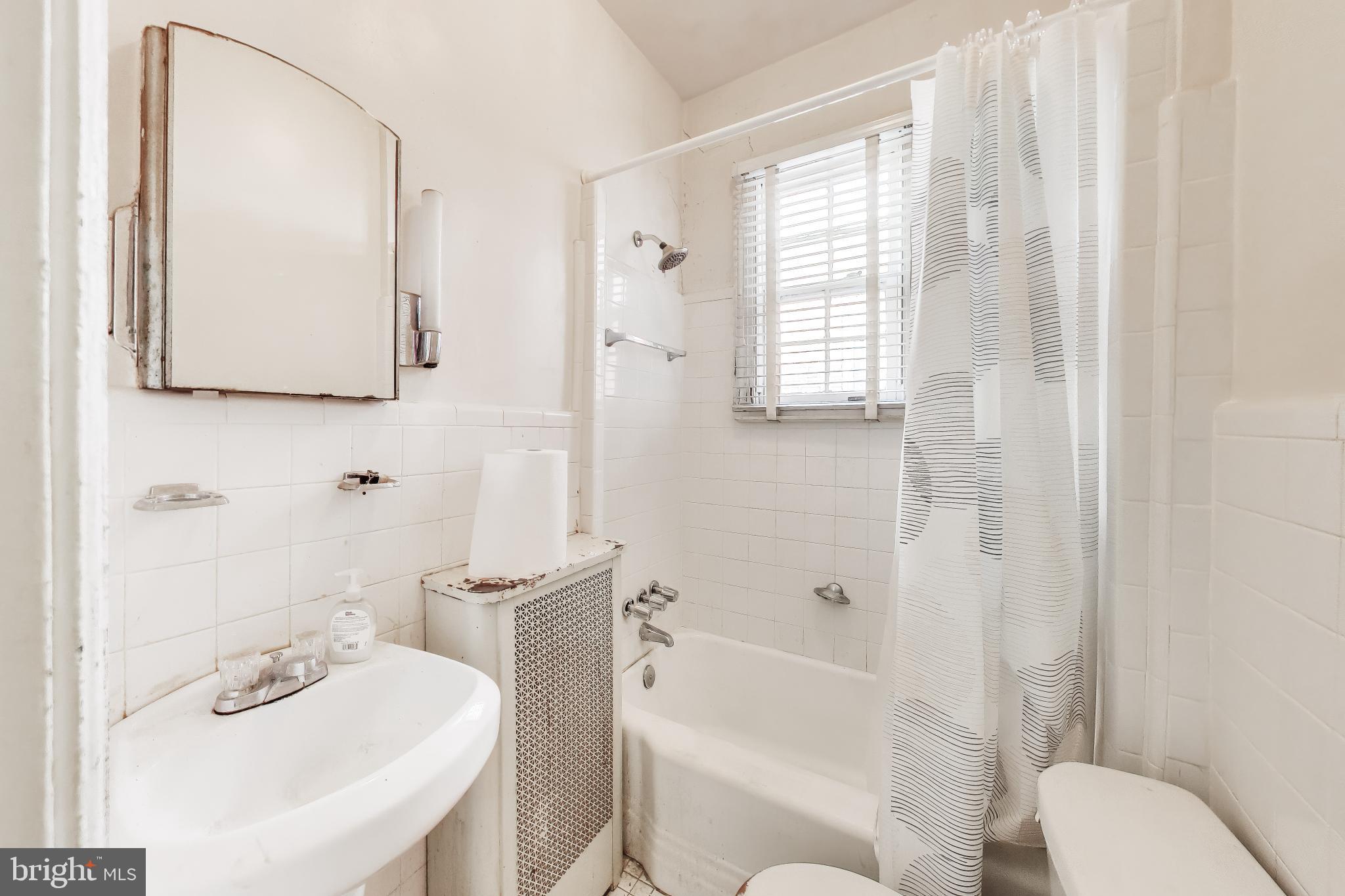 140 U Street Northwest Washington, DC 20001 - Photo 28 of 39 a bathroom with a sink toilet and shower