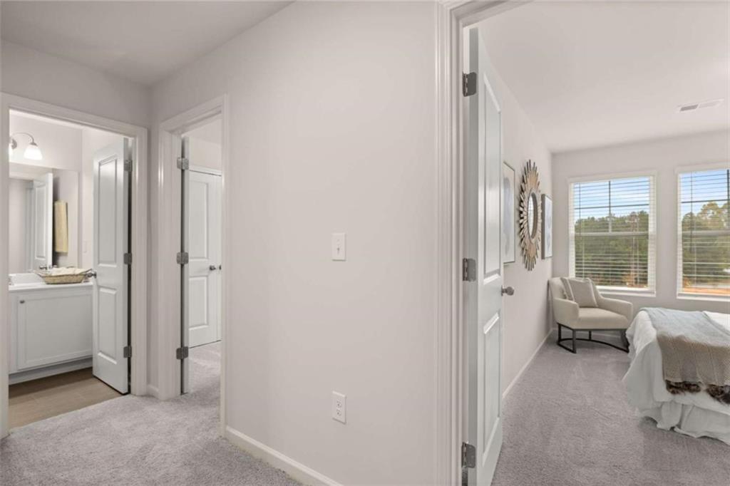1034 Merritt Drive, Unit 18 Villa Rica, GA 30180 - Photo 16 of 37 a view of a livingroom with lounge chair and windows