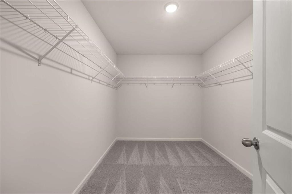 1034 Merritt Drive, Unit 18 Villa Rica, GA 30180 - Photo 21 of 37 a view of a room with racks on the wall