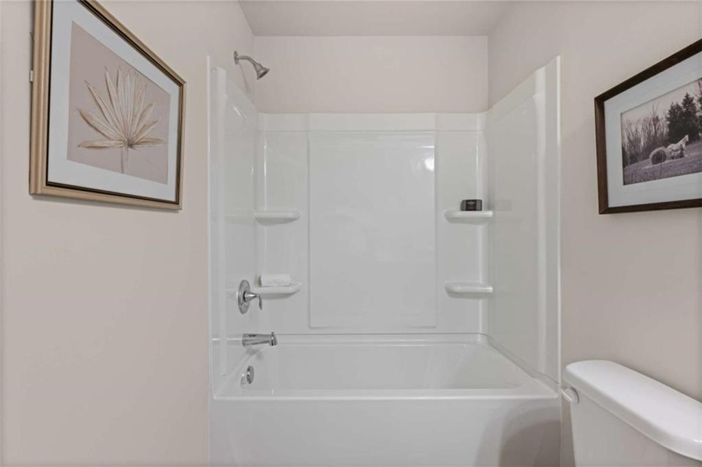1034 Merritt Drive, Unit 18 Villa Rica, GA 30180 - Photo 27 of 37 a bathroom with a bathtub and a shower