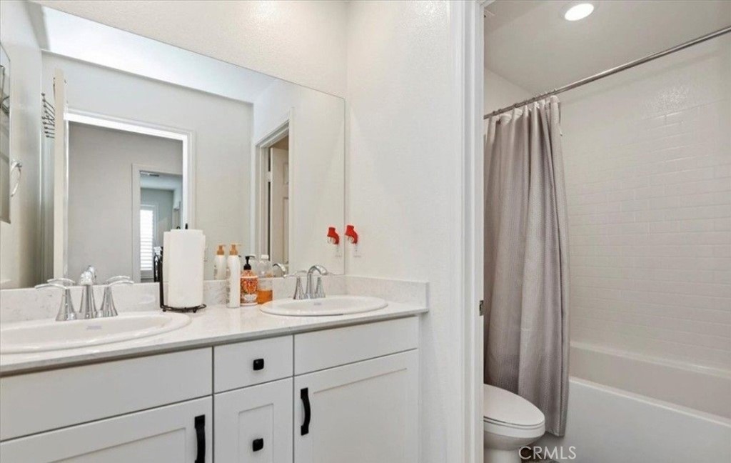 21288 Telegraph Road Riverside, CA 92507 - Photo 19 of 23 a bathroom with a sink toilet and shower