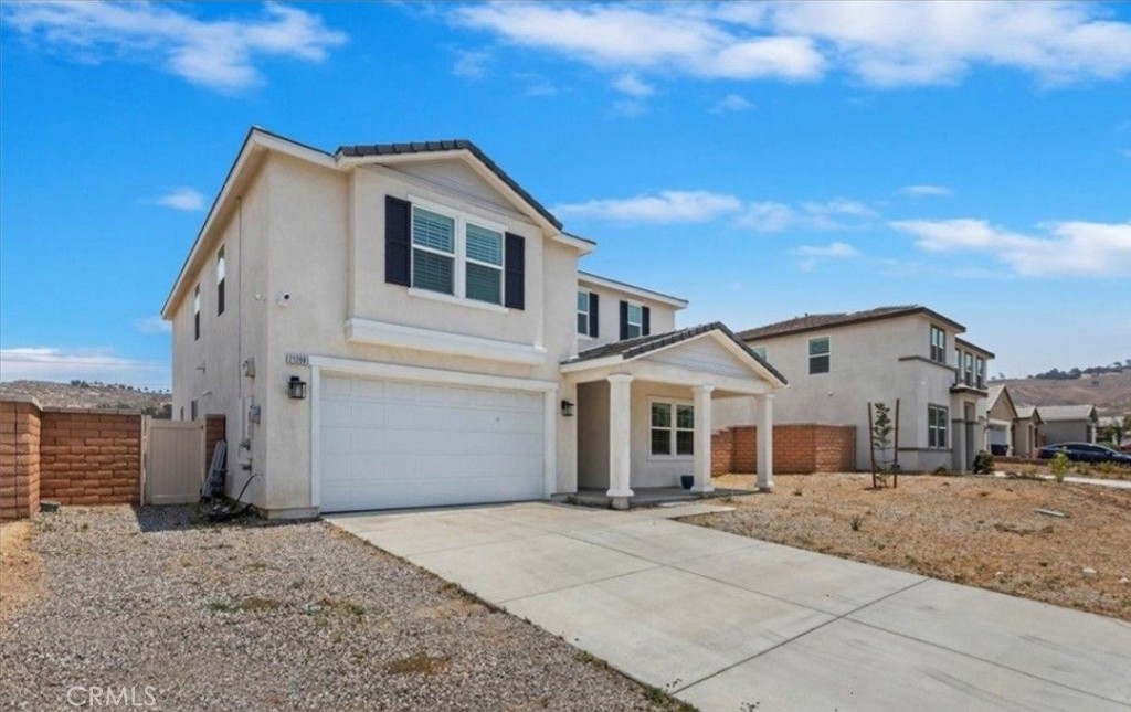 21288 Telegraph Road Riverside, CA 92507 - Photo 2 of 23 a front view of a house with a yard
