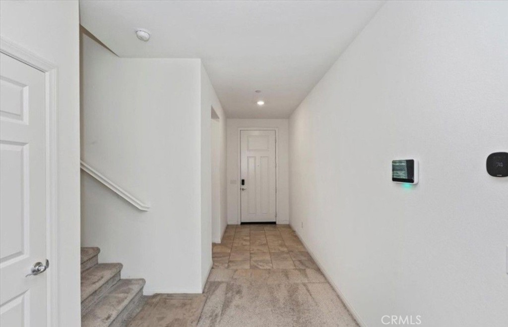 21288 Telegraph Road Riverside, CA 92507 - Photo 3 of 23 a view of a hallway with wooden floor and closet