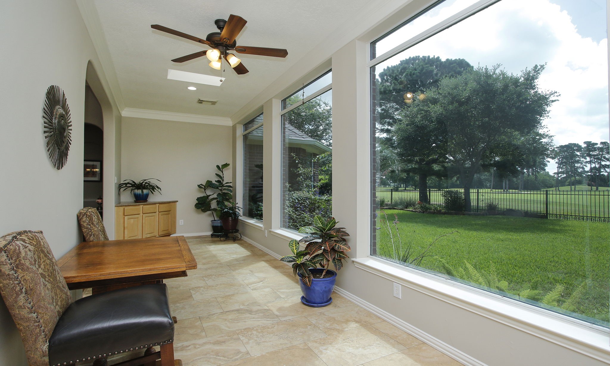 20110 Stormy Pine Lane Spring, TX 77379 - Photo 22 of 44 This sunroom provides an ideal place to relax or entertain in style. The corner built-in cabinet was thoughtfully designed for serving and storage.