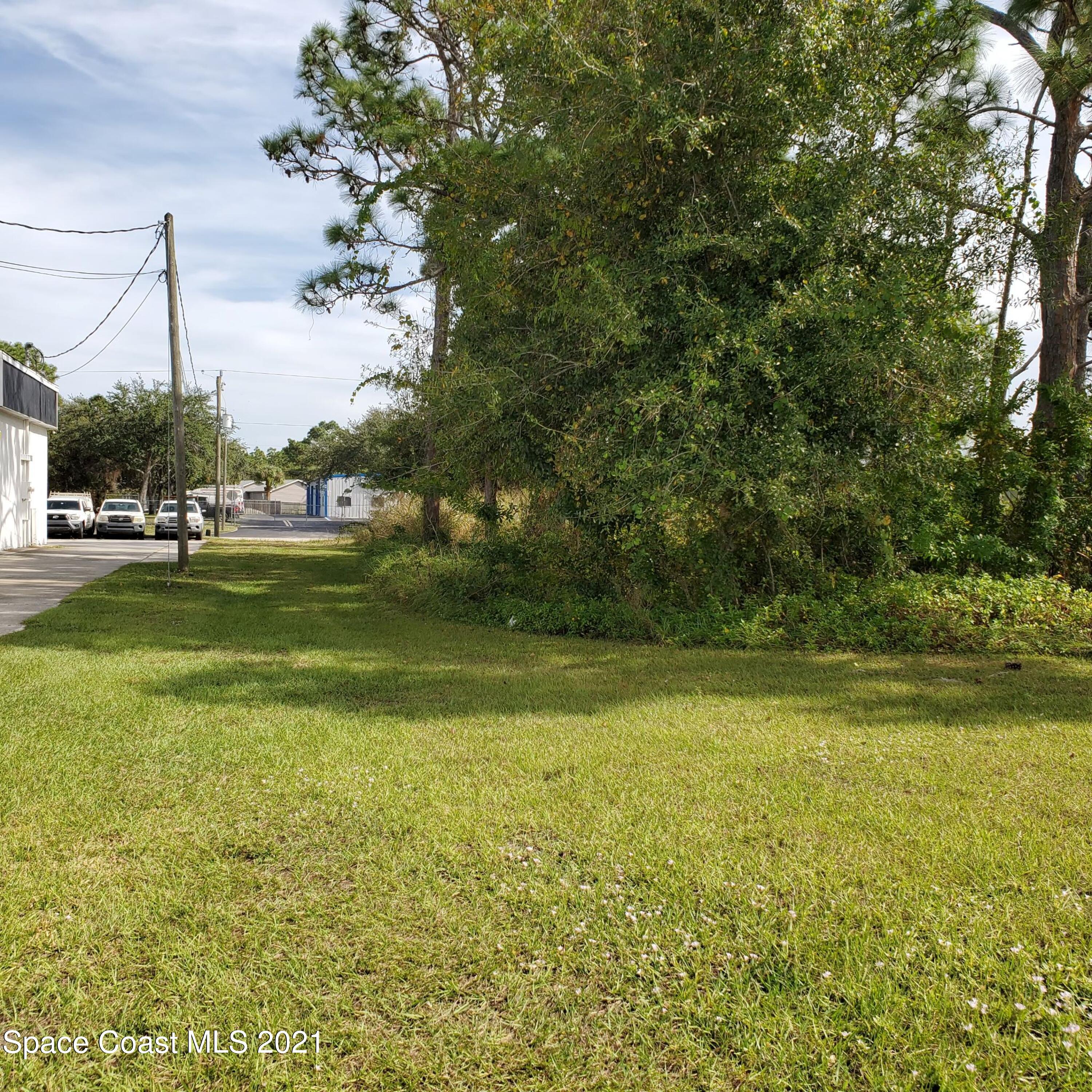 446 Martin Road Palm Bay, FL 32909 - Photo 4 of 10 a view of a large body of water with a house