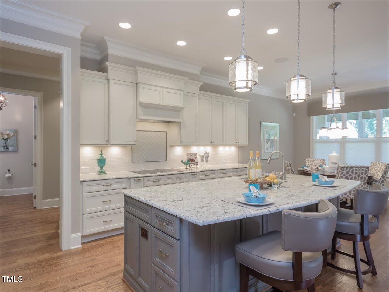 3105 Colmar Manor Drive Cary, NC 27519 - Photo 12 of 61 a kitchen with a table and chairs in it