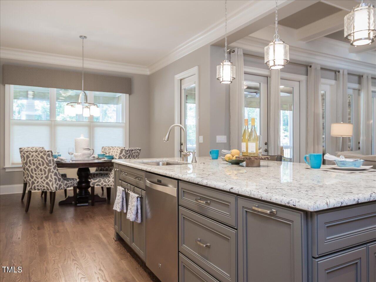 3105 Colmar Manor Drive Cary, NC 27519 - Photo 13 of 61 a kitchen with center island table and chairs