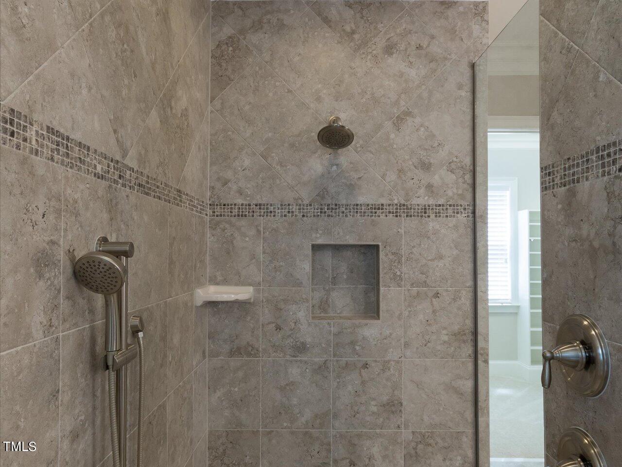 3105 Colmar Manor Drive Cary, NC 27519 - Photo 24 of 61 a bathroom with a shower