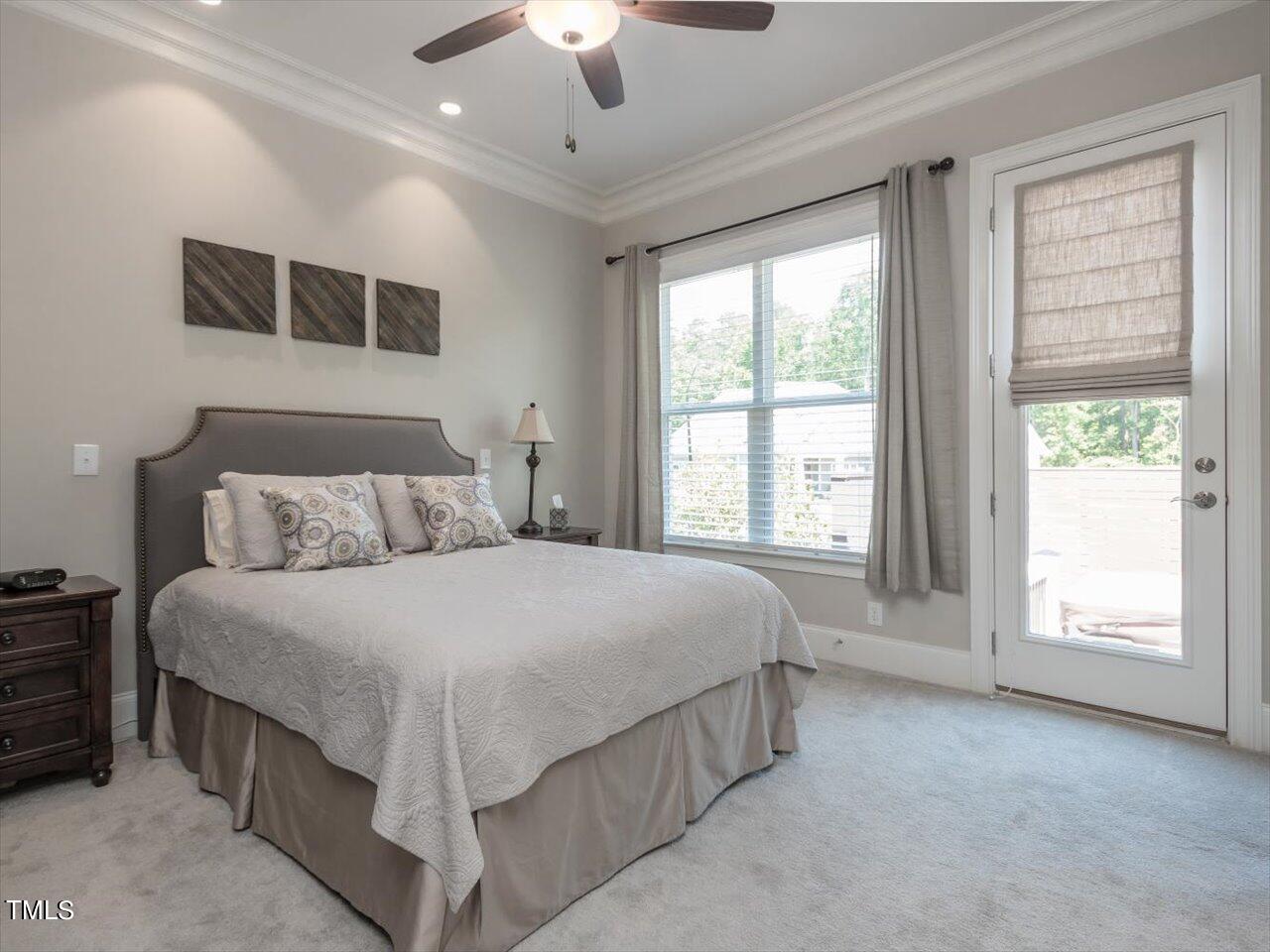 3105 Colmar Manor Drive Cary, NC 27519 - Photo 33 of 61 a spacious bedroom with a large bed and a large window