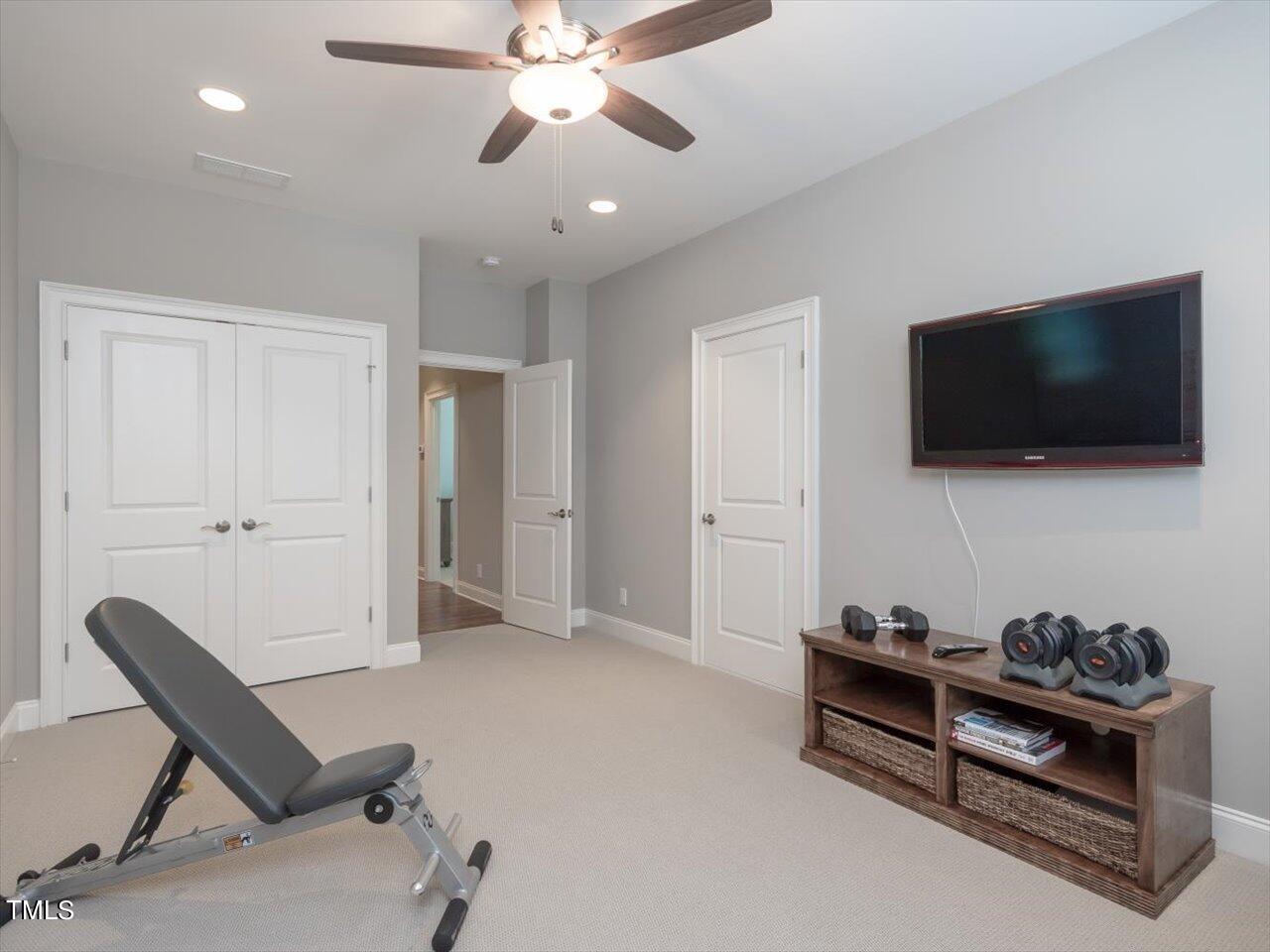 3105 Colmar Manor Drive Cary, NC 27519 - Photo 44 of 61 a view of a livingroom with furniture and a flat screen tv