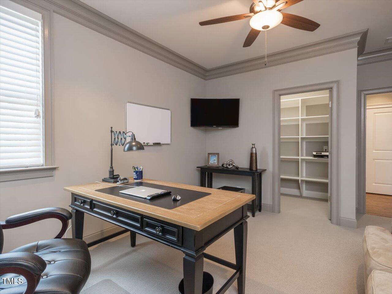 3105 Colmar Manor Drive Cary, NC 27519 - Photo 47 of 61 a room with furniture and a flat screen tv