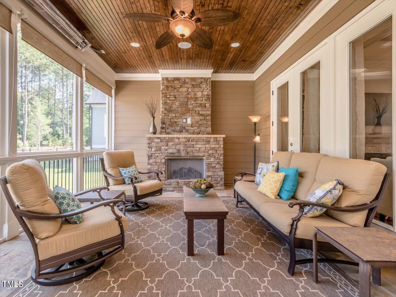 3105 Colmar Manor Drive Cary, NC 27519 - Photo 49 of 61 a living room with furniture and a fireplace