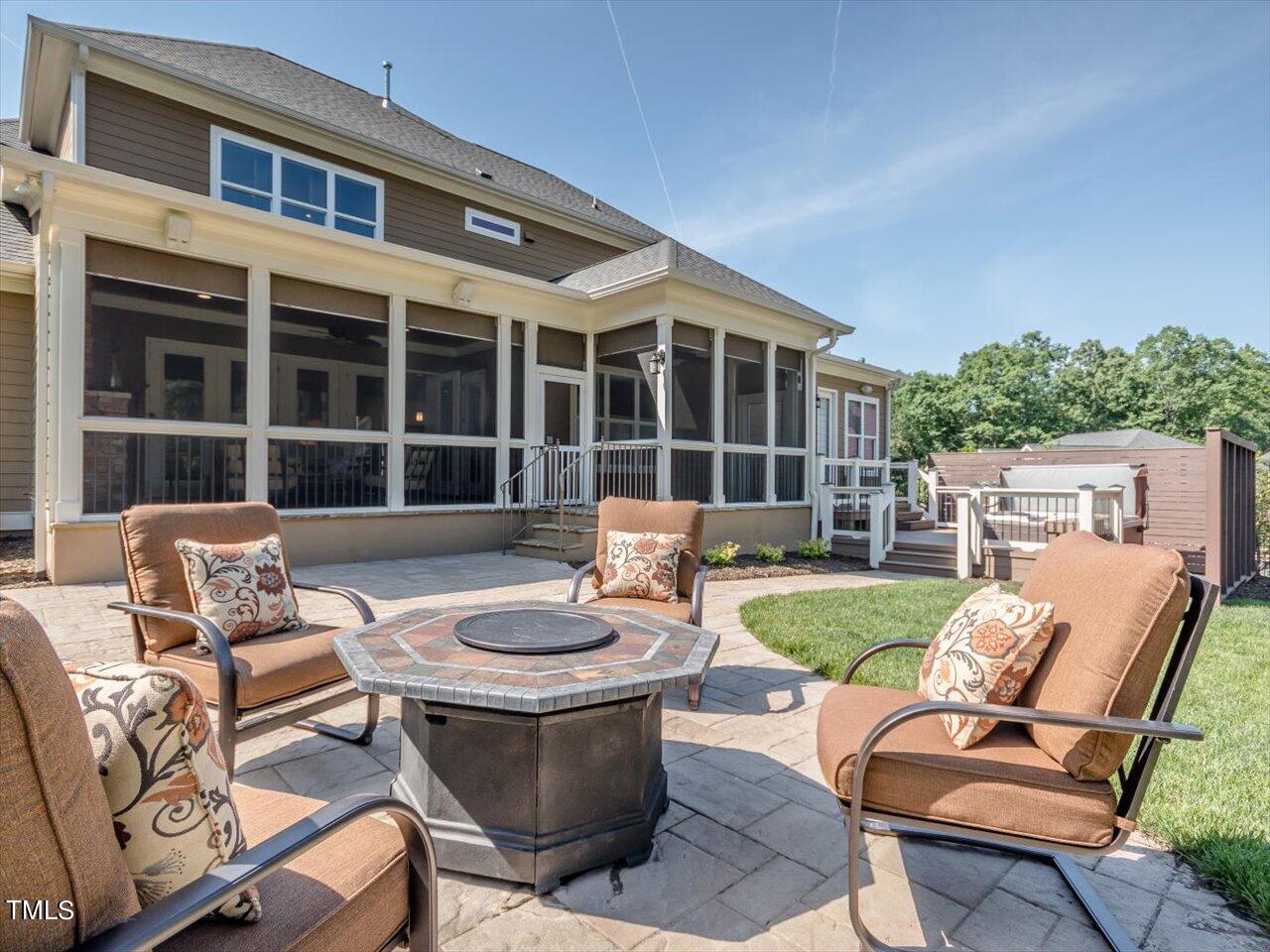 3105 Colmar Manor Drive Cary, NC 27519 - Photo 55 of 61 a view of a patio with couches table and chairs and potted plants