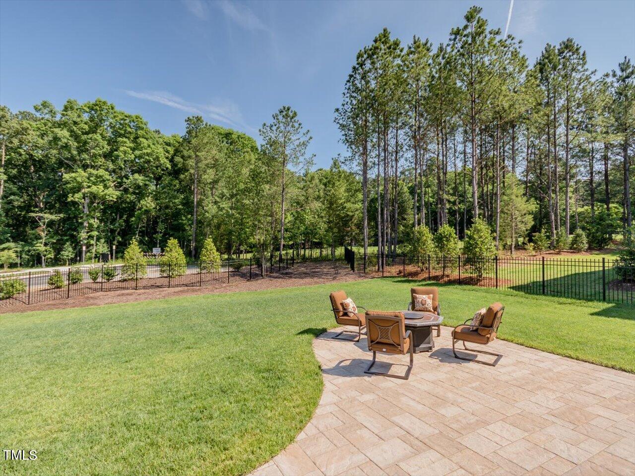 3105 Colmar Manor Drive Cary, NC 27519 - Photo 56 of 61 a view of a swimming pool and lounge chairs in back yard