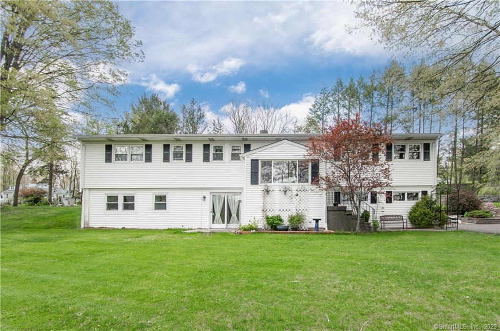 251 Whisconier Road Brookfield, CT 06804 - Photo 1 of 1 a view of an house with backyard space and garden
