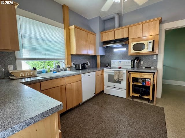 904 Penn Avenue La Grande, OR 97850 - Photo 12 of 46 a kitchen with stainless steel appliances granite countertop wooden cabinets stove top oven and sink