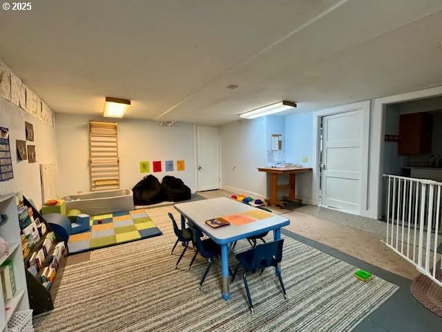 a living room with furniture a flat screen tv and a table