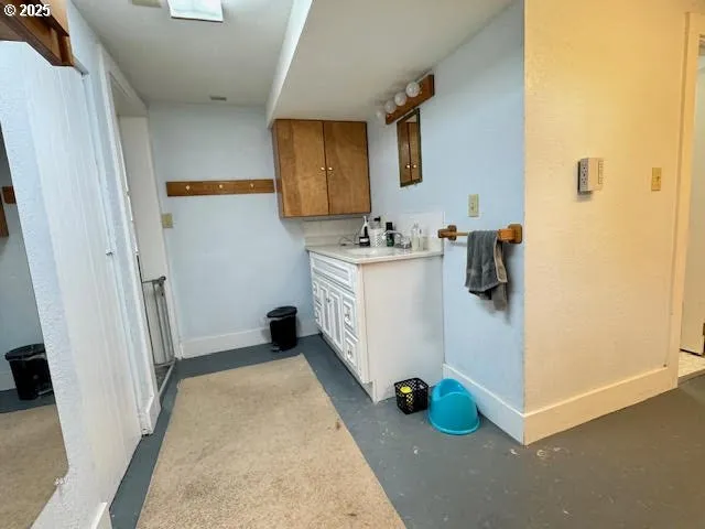 a view of a kitchen with storage and utility