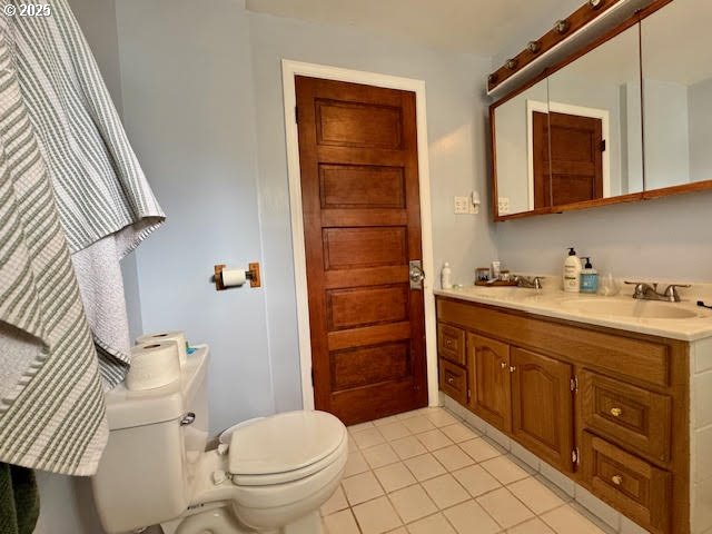 904 Penn Avenue La Grande, OR 97850 - Photo 26 of 46 a bathroom with a granite countertop toilet sink and mirror