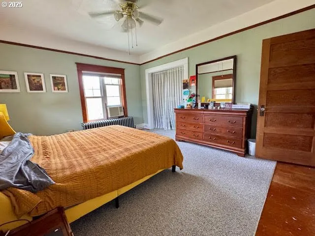 a bed room with a bed and a chandelier