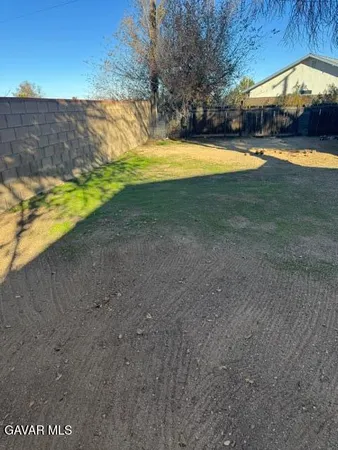a view of a swimming pool with an outdoor space and seating area