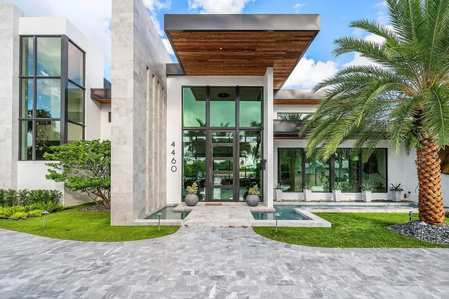 a bedroom with furniture and a large window