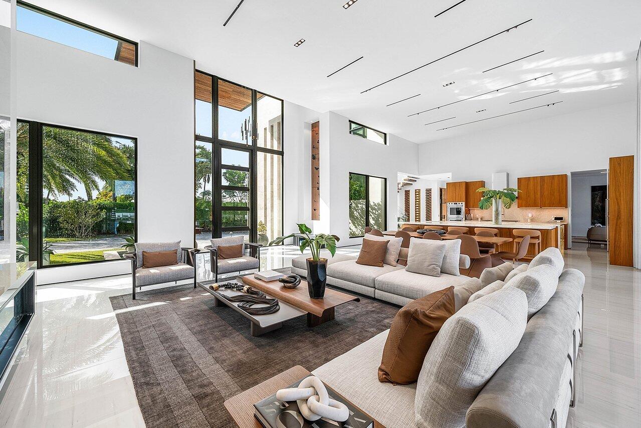 4460 Northeast 31st Avenue Lighthouse Point, FL 33064 - Photo 16 of 152 a living room with furniture and large windows