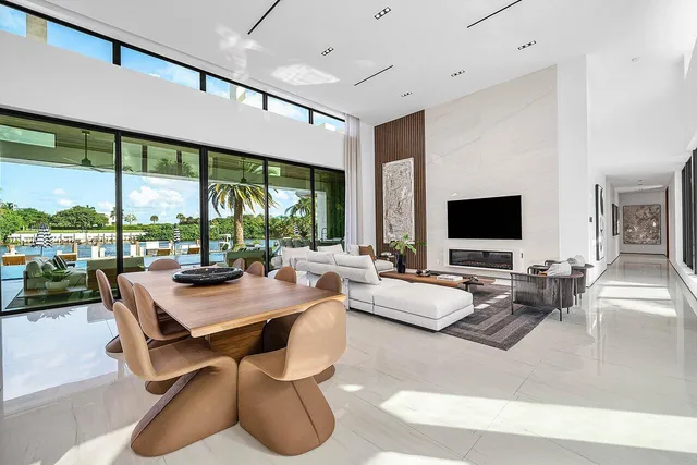 a spacious bedroom with a bed and a large window