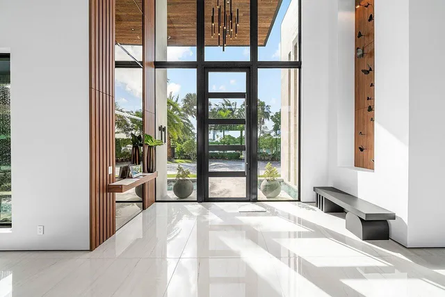 a bathroom with a double vanity sink a mirror and a shower