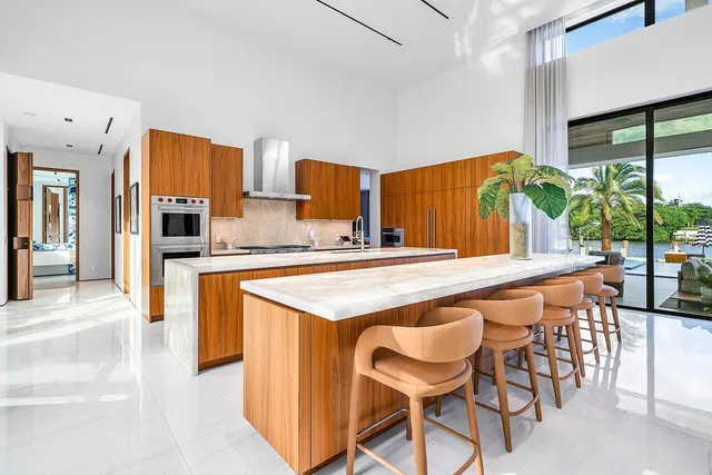a bathroom with double vanity sinks and a shower