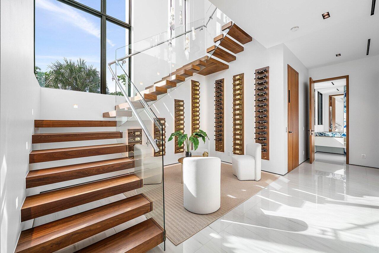 4460 Northeast 31st Avenue Lighthouse Point, FL 33064 - Photo 25 of 152 a view of staircase with white walls and stairs