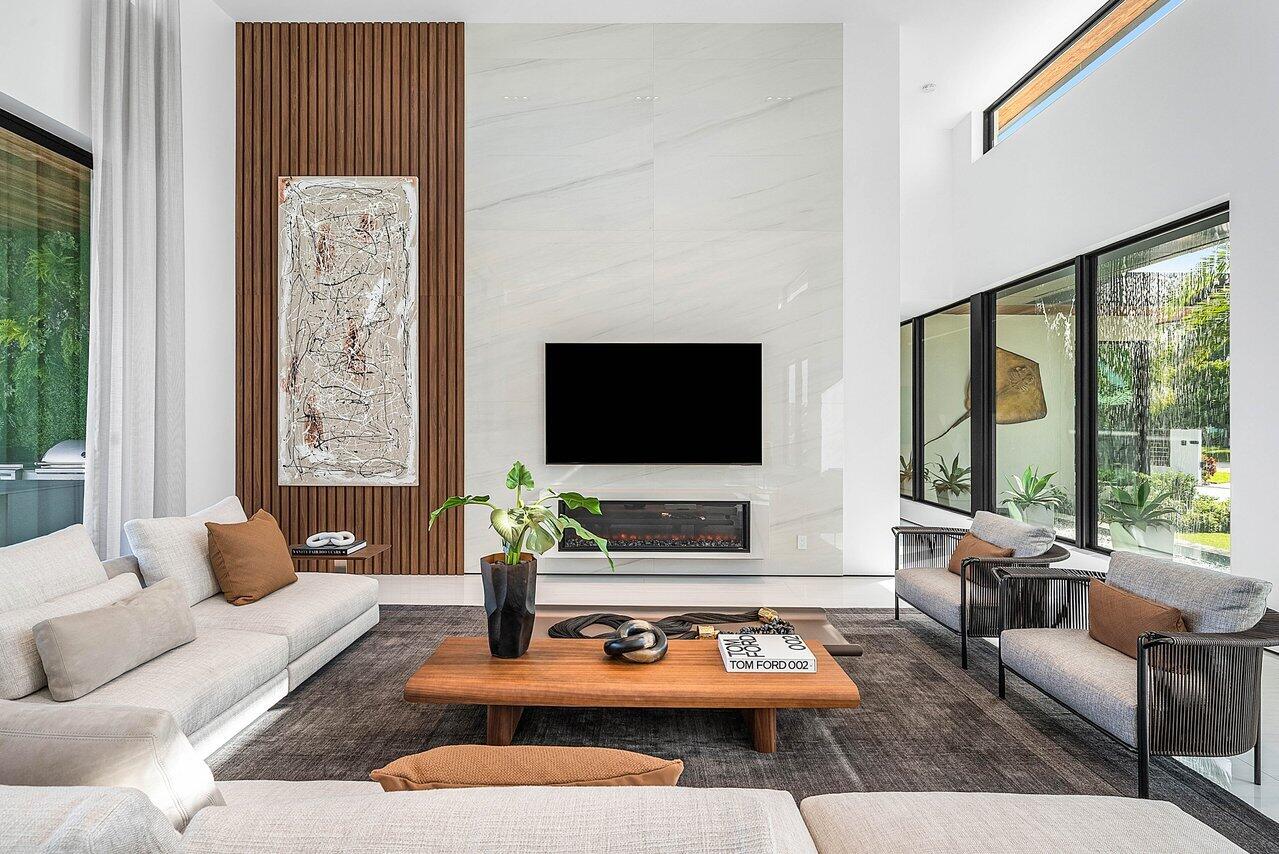 4460 Northeast 31st Avenue Lighthouse Point, FL 33064 - Photo 32 of 152 a living room with furniture a flat screen tv and a large window