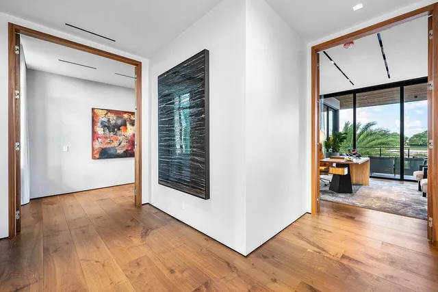 a view of a house with backyard swimming pool and sitting area
