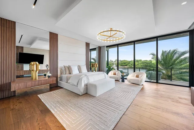 a view of a house with a yard patio and swimming pool