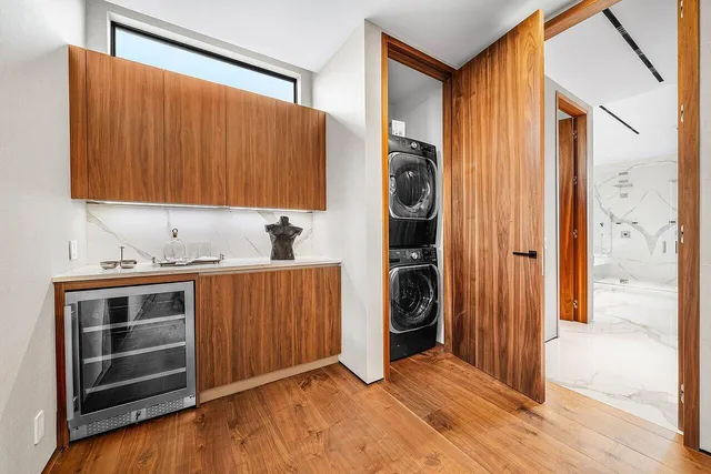 an aerial view of a house with a yard and lake view