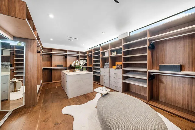 an aerial view of a house with a garden and swimming pool