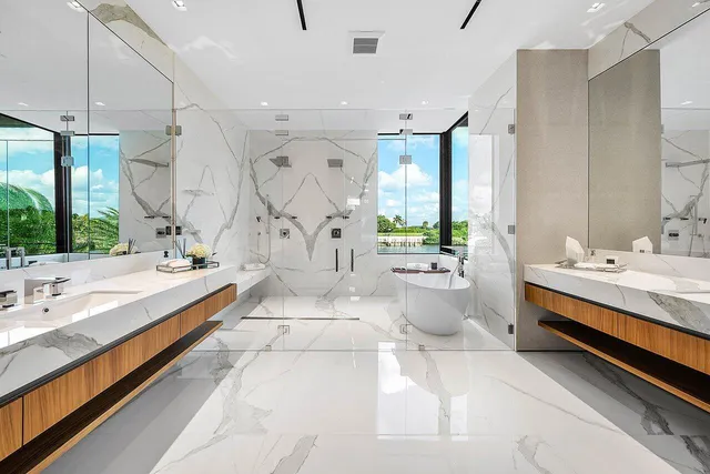 an aerial view of a house with a yard and seating space