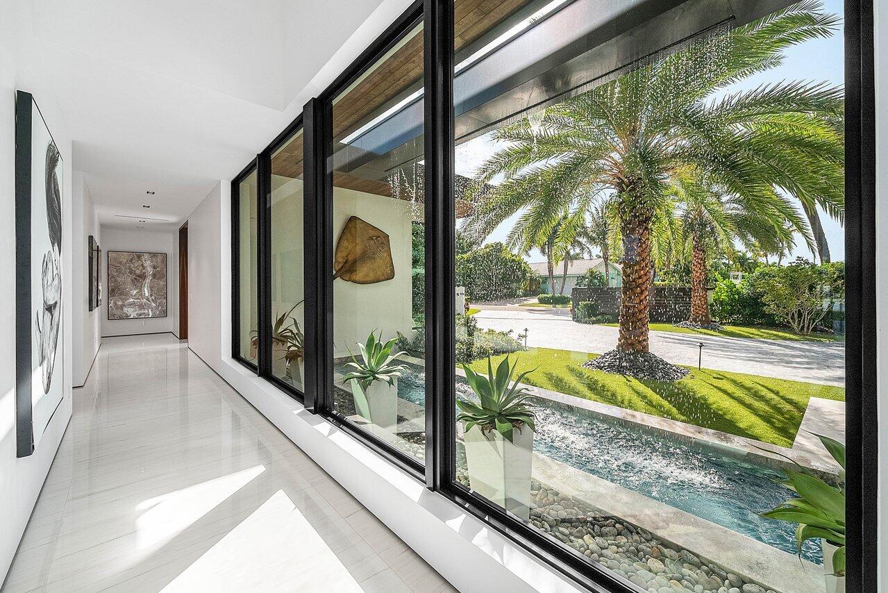 4460 Northeast 31st Avenue Lighthouse Point, FL 33064 - Photo 61 of 152 a view of swimming pool from a window