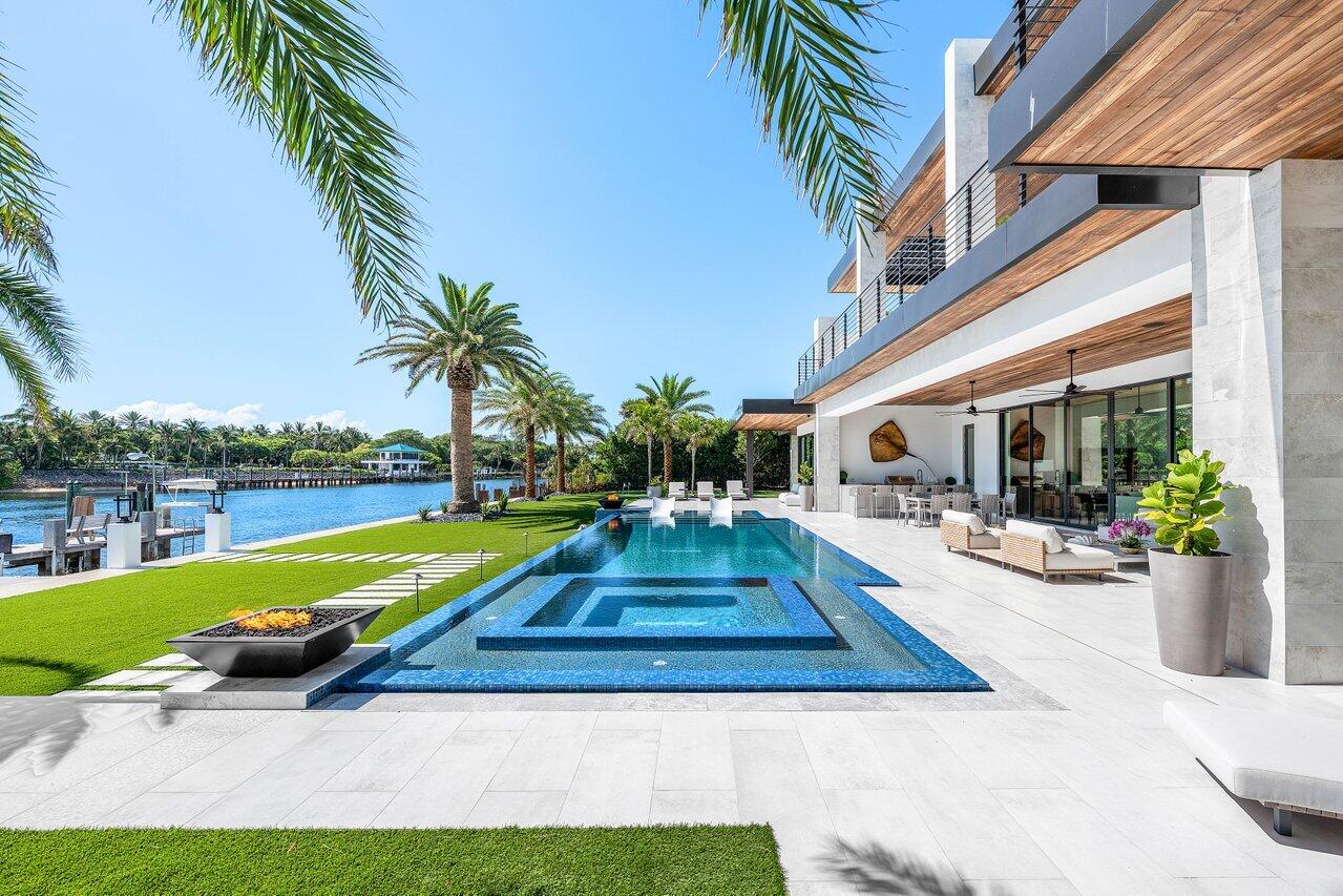 4460 Northeast 31st Avenue Lighthouse Point, FL 33064 - Photo 82 of 152 a view of a house with backyard swimming pool and sitting area