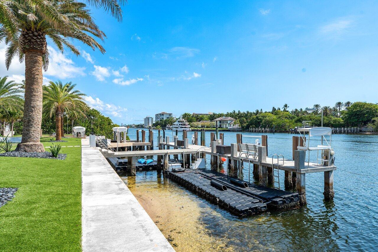 4460 Northeast 31st Avenue Lighthouse Point, FL 33064 - Photo 89 of 152 a view of a lake with chairs