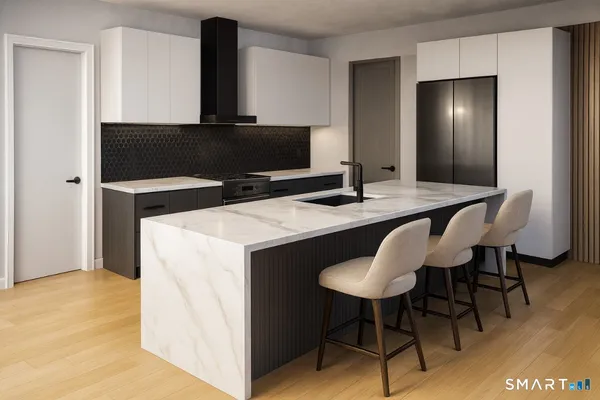 a kitchen with a table and chairs