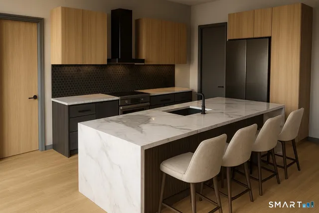 a kitchen with a table and chairs