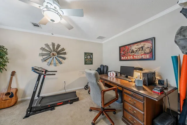 a view of a workspace with furniture