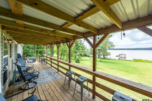 a view of porch with wooden floor